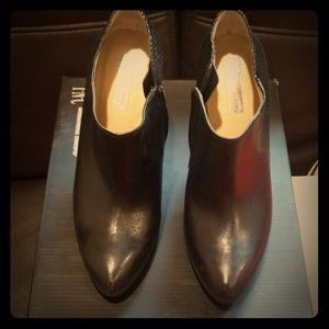 Black leather low cut platform boots.